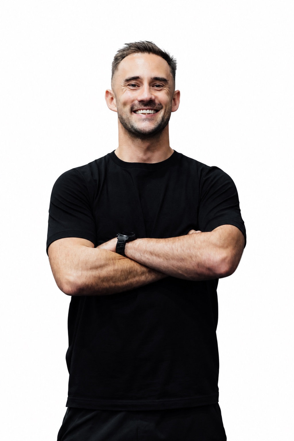 Jay Clark smiling in a black T-shirt with arms crossed